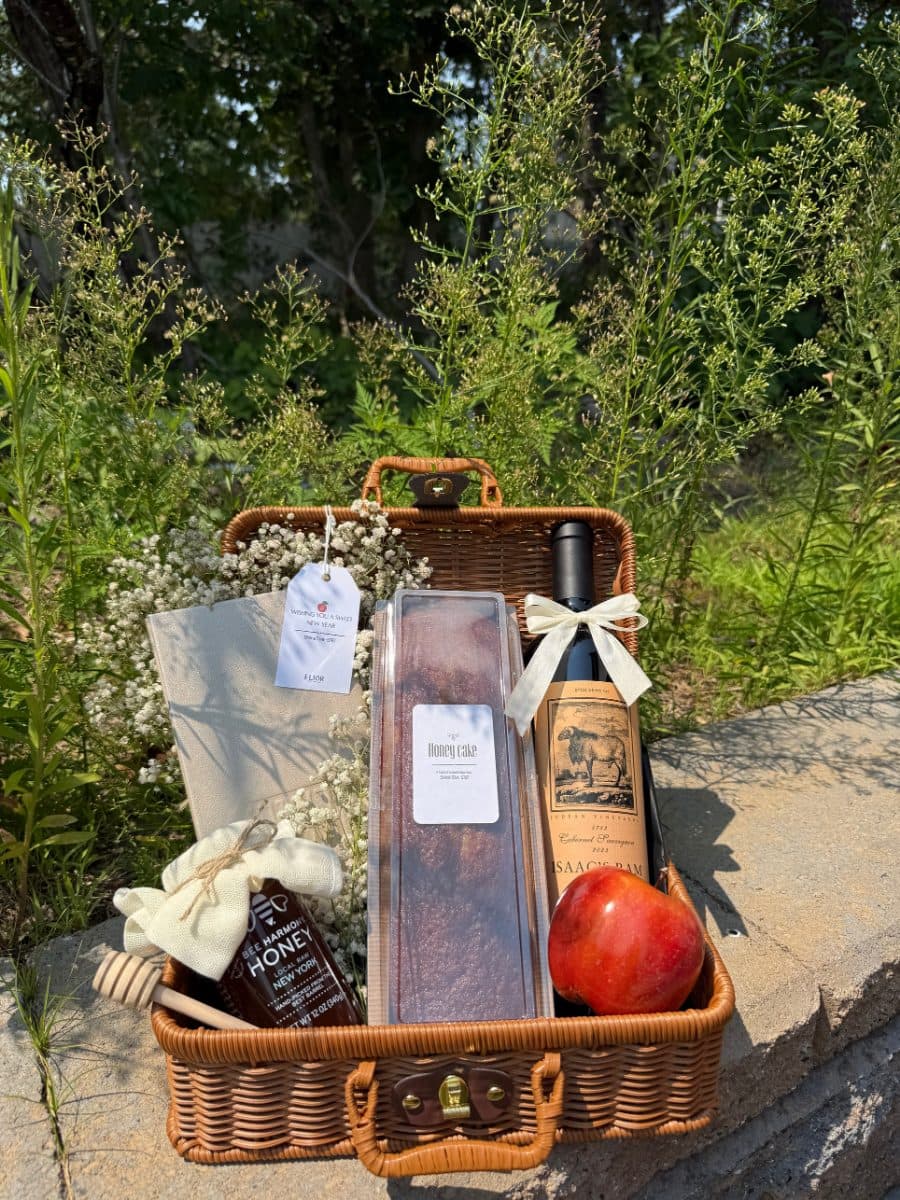 The Premium — a basket with Isaac’s Ram Cabernet, honey cake, premium honey, baby’s breath and a leather Rosh Hashanah booklet