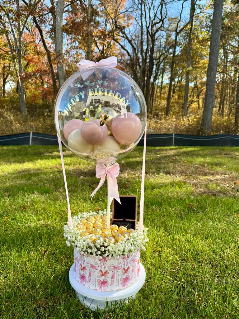 Signature balloon box with pastel balloons and flowers